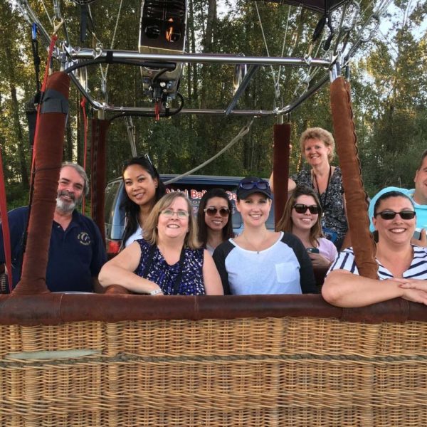 People in the basket of a hot air balloon ready for a ride